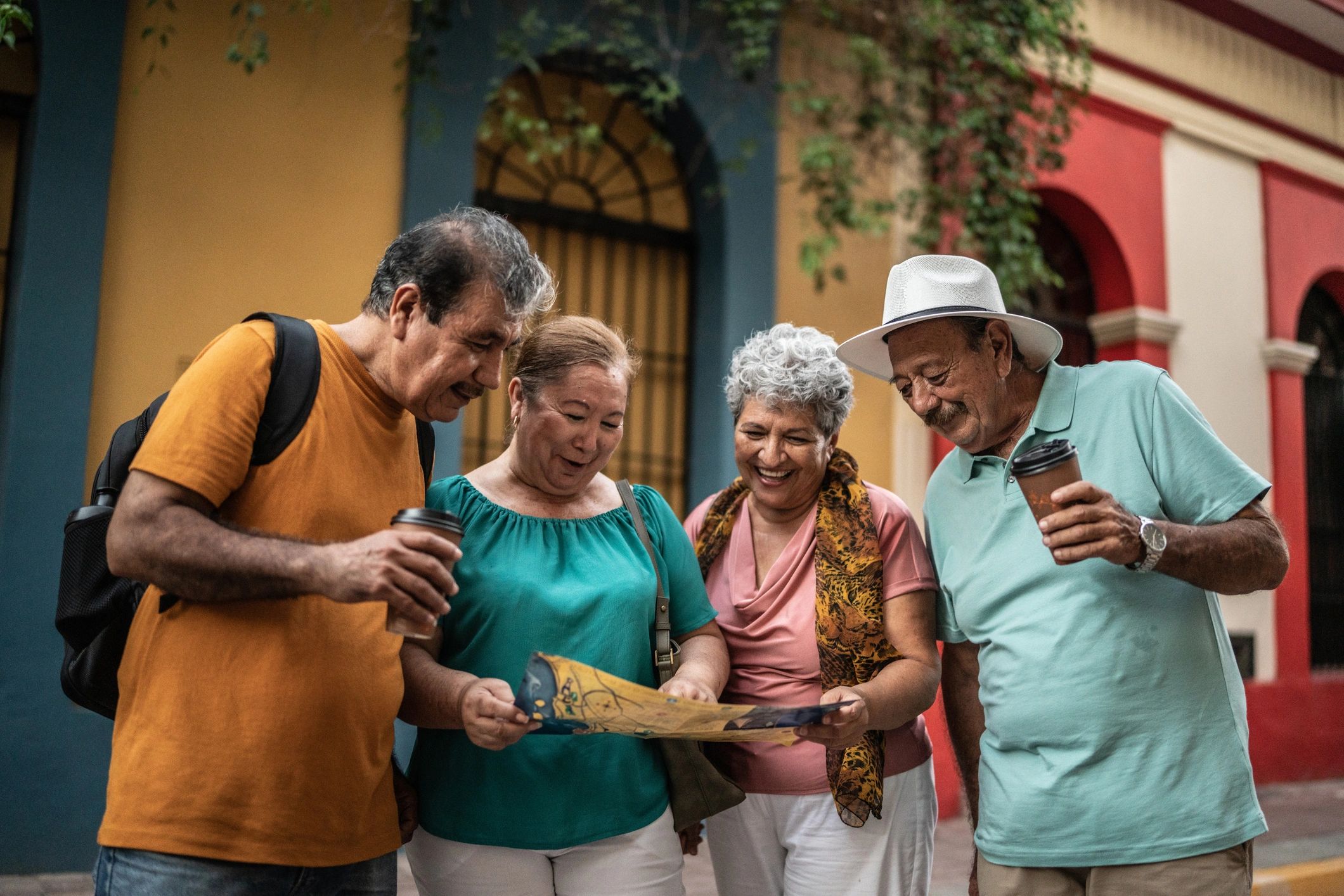 Friends looking at a map together in a historic district