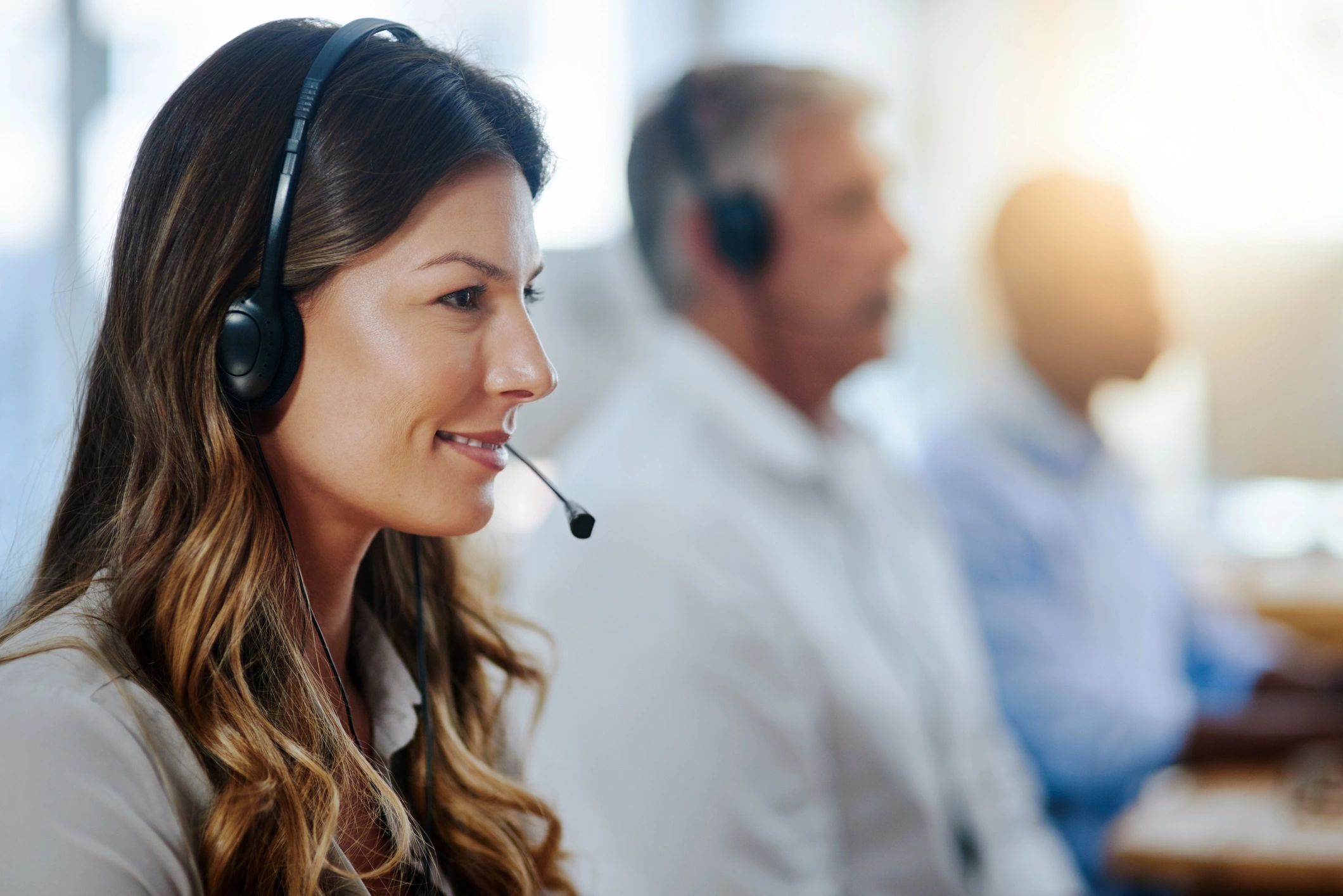 Customer service agent with headset at a call center